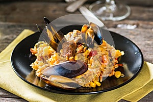 Typical spanish seafood paella in traditional pan. Spanish food. Valencian dish. Rice with seafood.