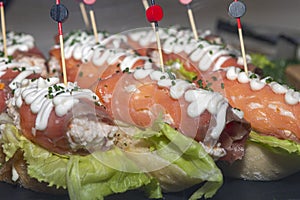 typical spanish snack called pincho with salmon