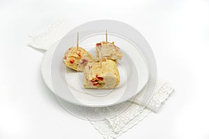 Typical spanish tortilla de patatas pintxo on a white background