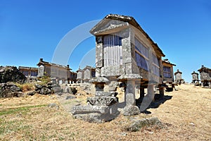 Typical stone corn driers, called Espigueiros in Lindoso, north of Portugal photo