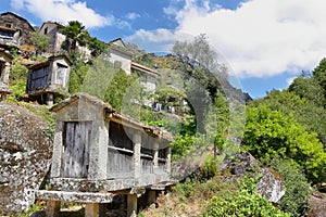 Typical stone corn driers, called Espigueiros near Sistelo, north of Portugal photo