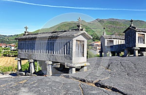 Typical stone corn driers, called Espigueiros in Soajo, north of Portugal photo