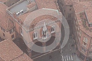 Typical street and buildings of Bologna in the fog. View from a narrow window of Asinelli Tower. Emilia Romagna , Italy.