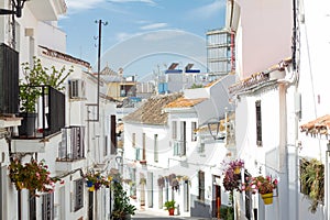 A typical street in old city Estepona with colorful flower pots. Estepona, Andalusia, Spain