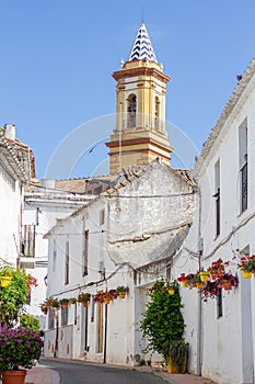 A typical street in old city Estepona with colorful flower pots. Estepona, Andalusia, Spain