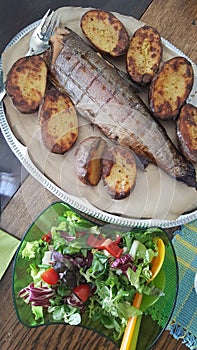 Typical summer dish in Finland with smoked fish, potatoes and fresh salad