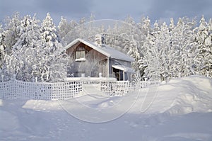 Typical swedish hut in winter