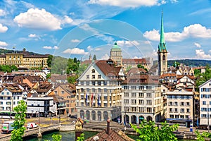 Typical Swiss old architecture with Preacher's Church Tower, Limmat river by the Rudolf Brun Bridge in Zurich