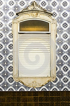 Typical tiled facade in Tavira town, Portugal