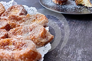 Typical torrijas during holy week in spain in dishes with doilie