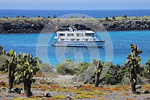 Typical tourist yacht anchored between South Plaza and North Plaza islands, Galapagos National Park, Ecuador