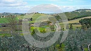 Typical Tuscan scenery with wineries, olive trees, and rolling hills