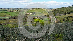 Typical Tuscan scenery with wineries, olive trees, and rolling hills