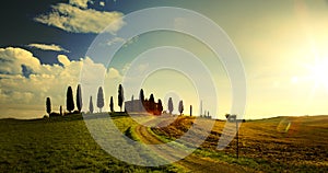 Typical Tuscany countryside landscape; sunset over rolling hills