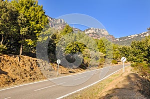 Typical upland road in Spain with crossed 60 km/h speed limit.