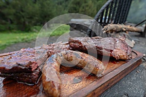 Typical Uruguayan and Argentine Asado Cooked on fire. Entrana and Vacio meat cuts. Accompanied with Chorizo photo