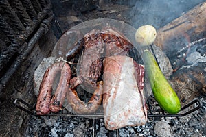 Typical Uruguayan and Argentine Asado Cooked on fire. Entrana and Vacio meat cuts. Accompanied with Chorizo photo