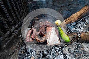 Typical Uruguayan and Argentine Asado Cooked on fire. Entrana and Vacio meat cuts. Accompanied with Chorizo photo