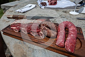 Typical Uruguayan and Argentine Asado Cooked on fire. Entrana and Vacio meat cuts. Accompanied with Chorizo photo