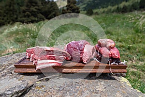 Typical Uruguayan and Argentine Asado Cooked on fire. Entrana and Vacio meat cuts. Accompanied with Chorizo photo