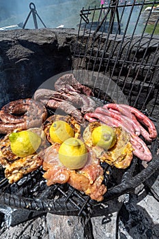 Typical Uruguayan and Argentine Asado Cooked on fire. Entrana and Vacio meat cuts. Accompanied with Chorizo photo