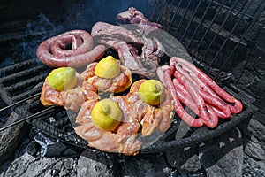 Typical Uruguayan and Argentine Asado Cooked on fire. Entrana and Vacio meat cuts. Accompanied with Chorizo photo