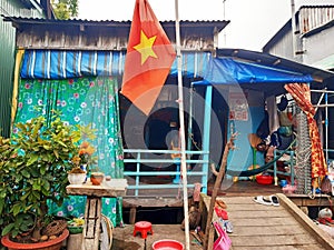 Typical Vietnamese house with Vietnam flag. Architecture and constructions of Asia. Vietnamese culture