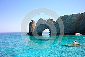 Typical view on Lalaria beach holey rock gate in Skiathos
