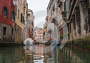 Typical view of the narrow side of the canal, Venice, Italy. Communication in the city is done by water, which creates a