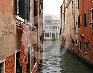 Typical view of the narrow side of the canal, Venice, Italy. Communication in the city is done by water, which creates a