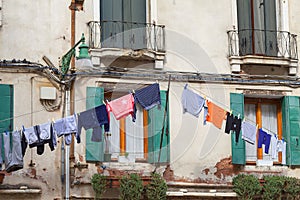Typical view; the streets of Venice; washed clothes drying on cords outside the building, Venice, Italy co