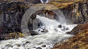 Typical water fall from melting glaciers in Iceland countryside