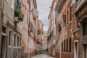 Typical well in calle alley, Venice, Italy