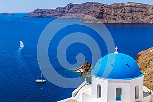 White and blue architecture with domes and churches in Oia, Santorini, Greece