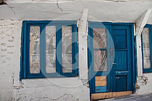 Typical white and blue painted doors and windows, very characteristic for Greek small villages