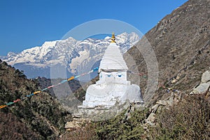 Typical white buddhist stupa near footpath to Everest base camp in Nepal photo