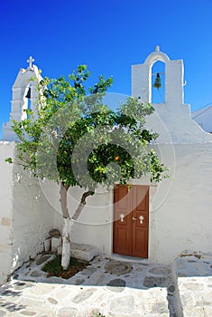 Typical white Greek church. Village square.