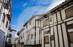 Typical white houses with wooden beams in the old town of Morella photo