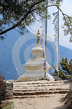 Typical white stone tibetan buddhist stupa in Himalayas