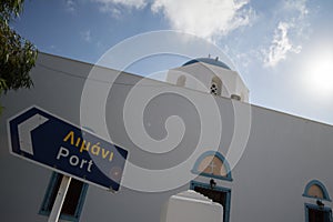 Typical Whitewashed Church with Street Sign in Adamantas, Milos, Greece