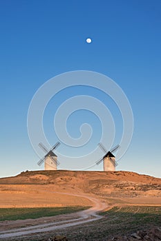 Typical windmill in with the moon at the background