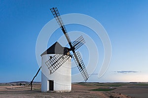 Typical windmill in with the moon at the background