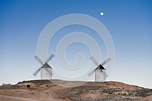 Typical windmill in with the moon at the background