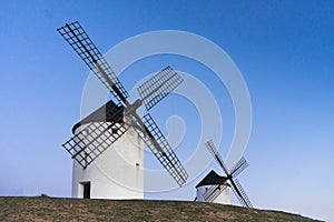 Typical windmill in with the moon at the background
