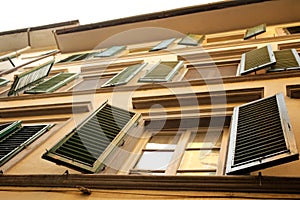 Typical windows with venetian blinds in Firenze, Italy