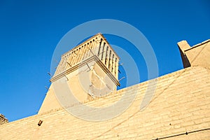 Typical Windtower made of clay taken in the streets of Yazd, iran. These towers, aimed at cooling down buildings in the desert