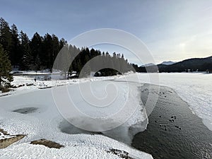 A typical winter idyll on the frozen and snow-covered alpine lake Heidsee (Igl Lai) in the winter resort Lenzerheide