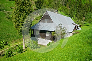 Typical wooden house in mountain village Prasnica near Stare Hory