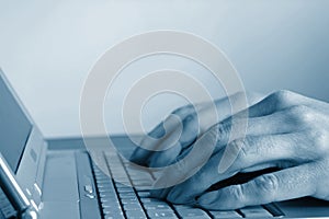 Typing hands on keyboard