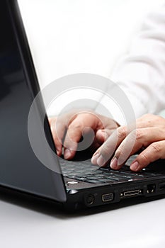 Typing on a laptop computer